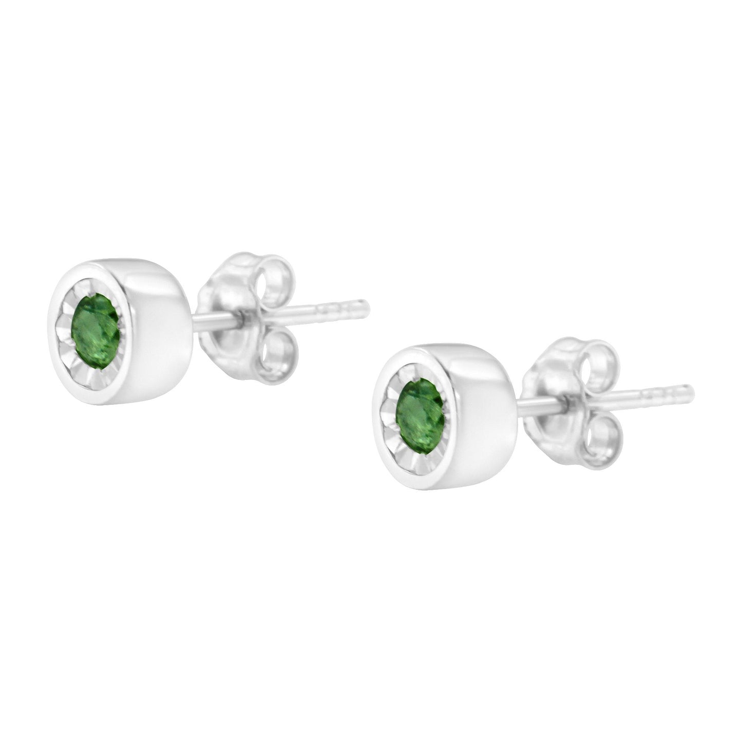Pair of white metal stud earrings with round green gemstones in miracle settings, shown at side angle.