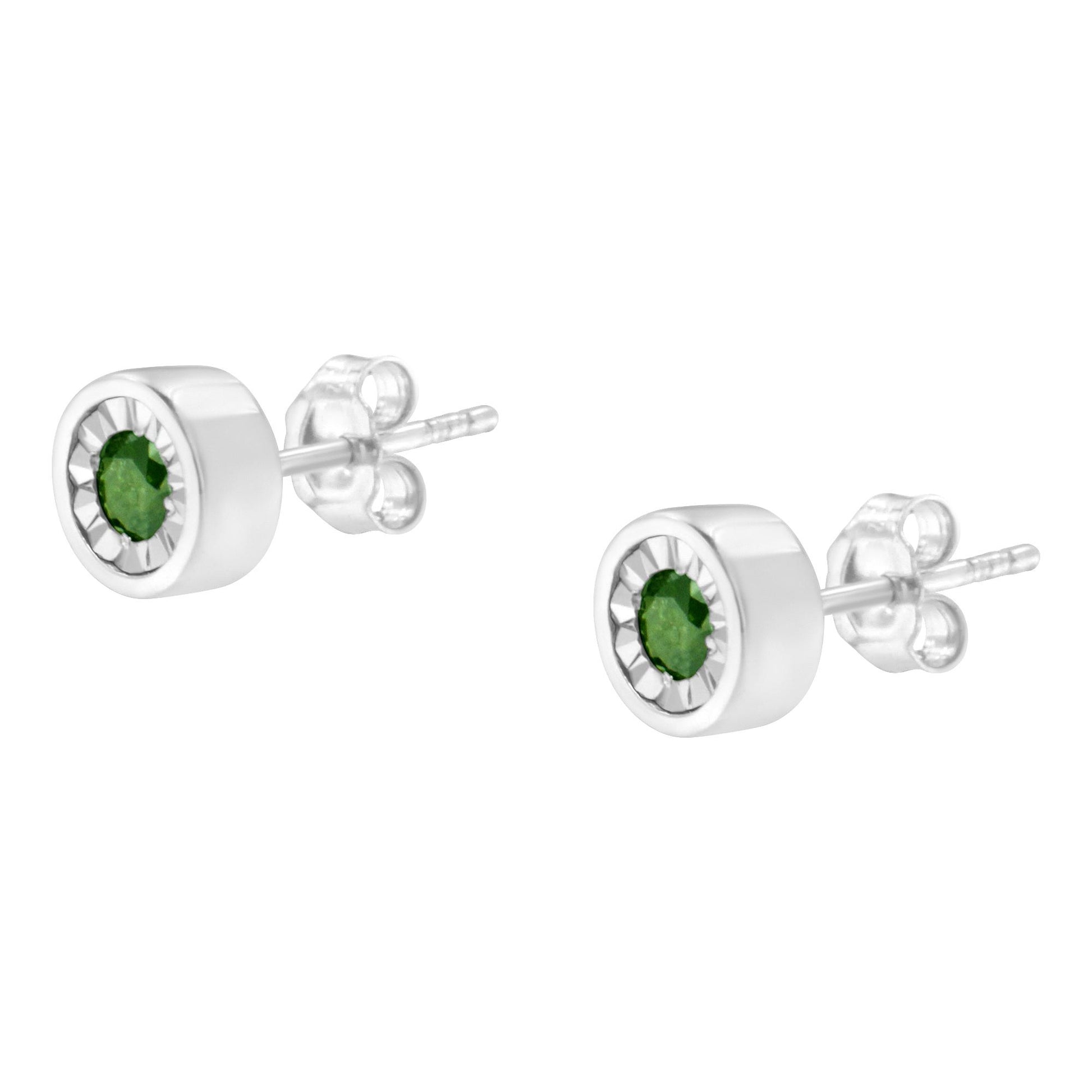 Pair of round green gemstone stud earrings set in white metal, shown from a front-side angle.