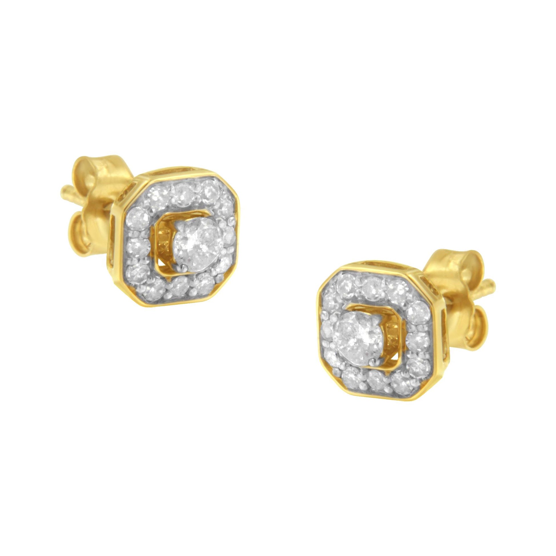 Pair of yellow metal stud earrings with a central round white gemstone in prong setting, surrounded by smaller round white gemstones in pave setting, shown from a front angle.