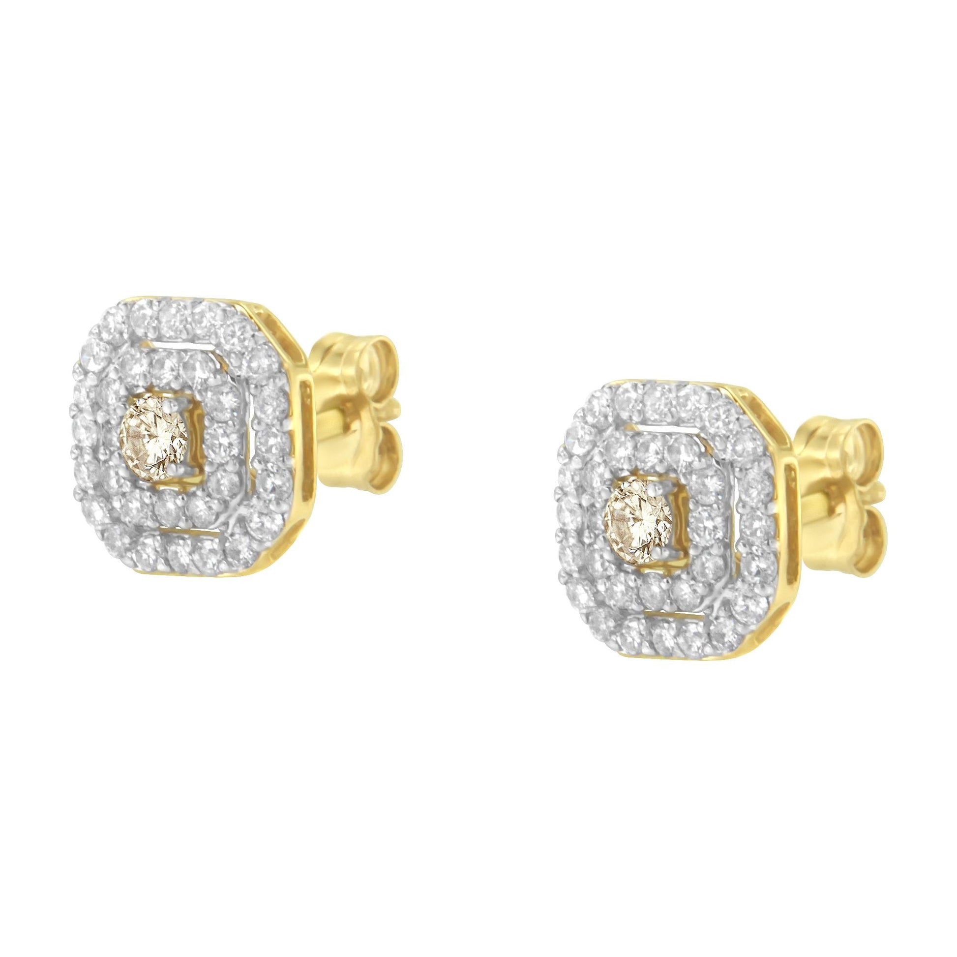 Pair of yellow metal stud earrings shown at a slight angle, each featuring a central round white gemstone in prong setting surrounded by two rows of smaller round white gemstones in pave setting.
