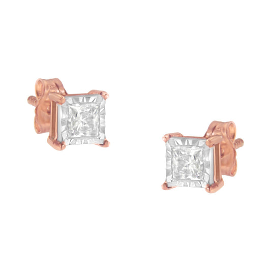 Pair of stud earrings with square white gemstones set in white and rose metal, shown from a slightly angled front view.
