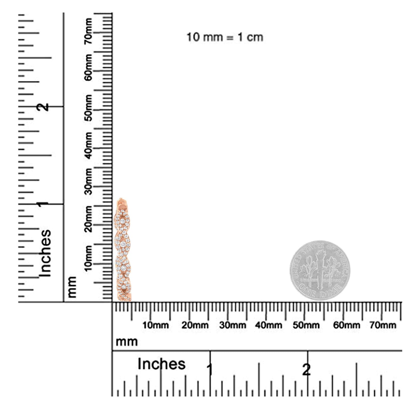 Close-up side view of a rose-colored metal earring with white round gemstones in prong settings, positioned next to rulers and a dime for size reference.