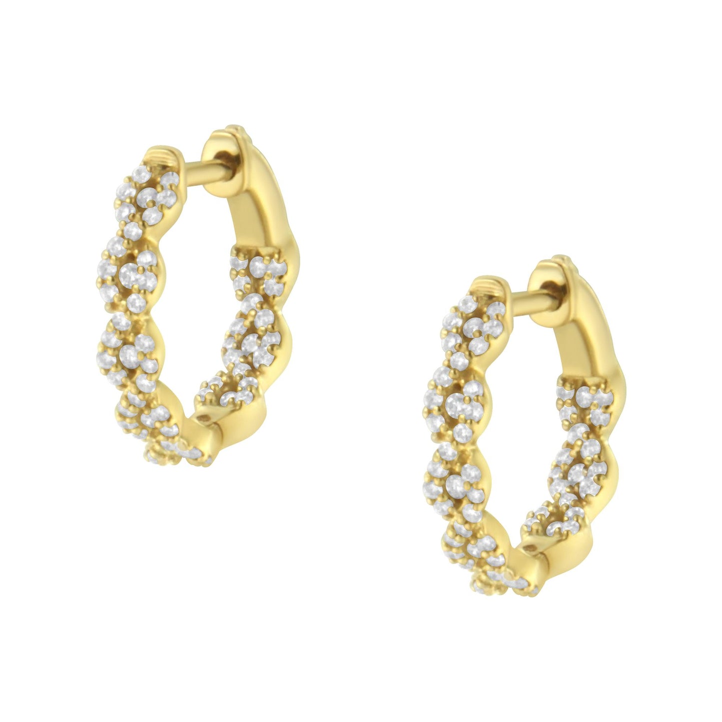 Close-up front angle of yellow metal hoop earrings with white round gemstones in prong settings arranged in a twisted design.