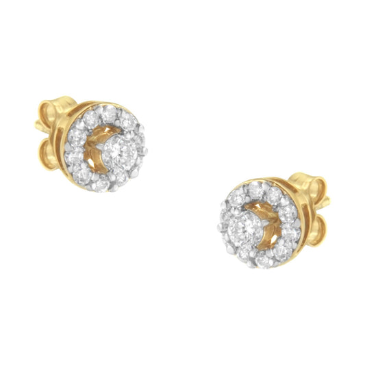 Pair of yellow metal stud earrings with round white gemstones in prong settings, shown from a front angle.