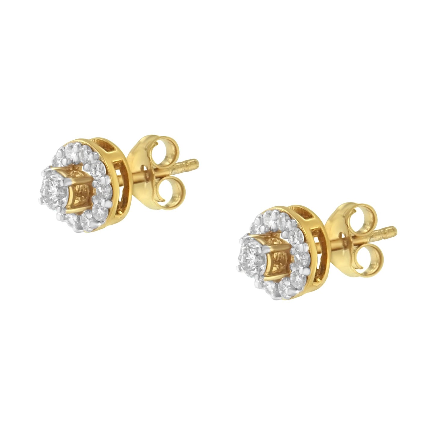 Pair of yellow metal stud earrings with round white gemstones in prong settings; photo taken at a slight side angle.