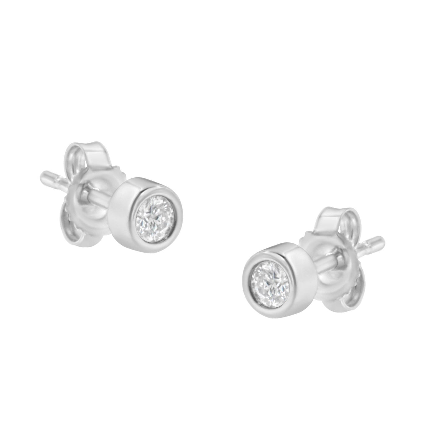 Pair of white metal stud earrings with round white gemstones in bezel settings, shown at a slight angle.