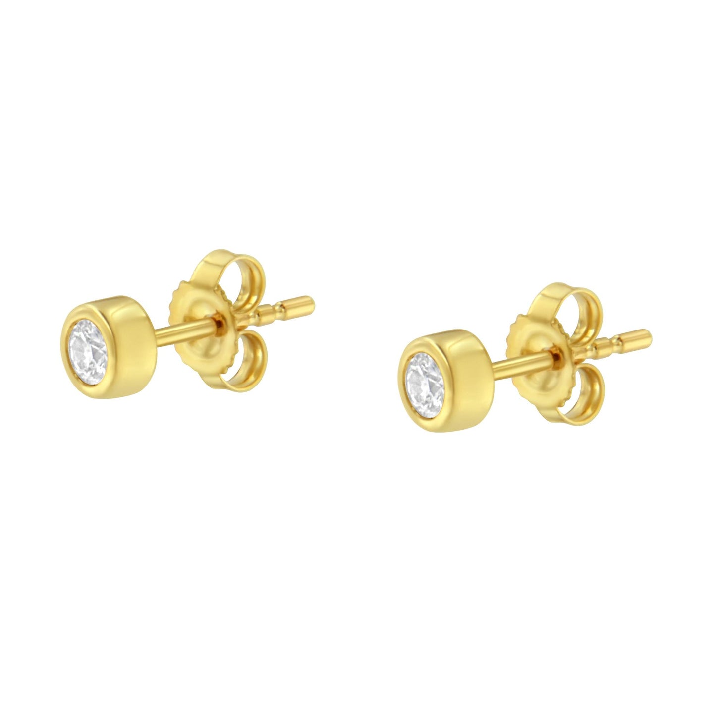 Pair of yellow metal stud earrings with round white gemstones in bezel settings, shown from a side angle.