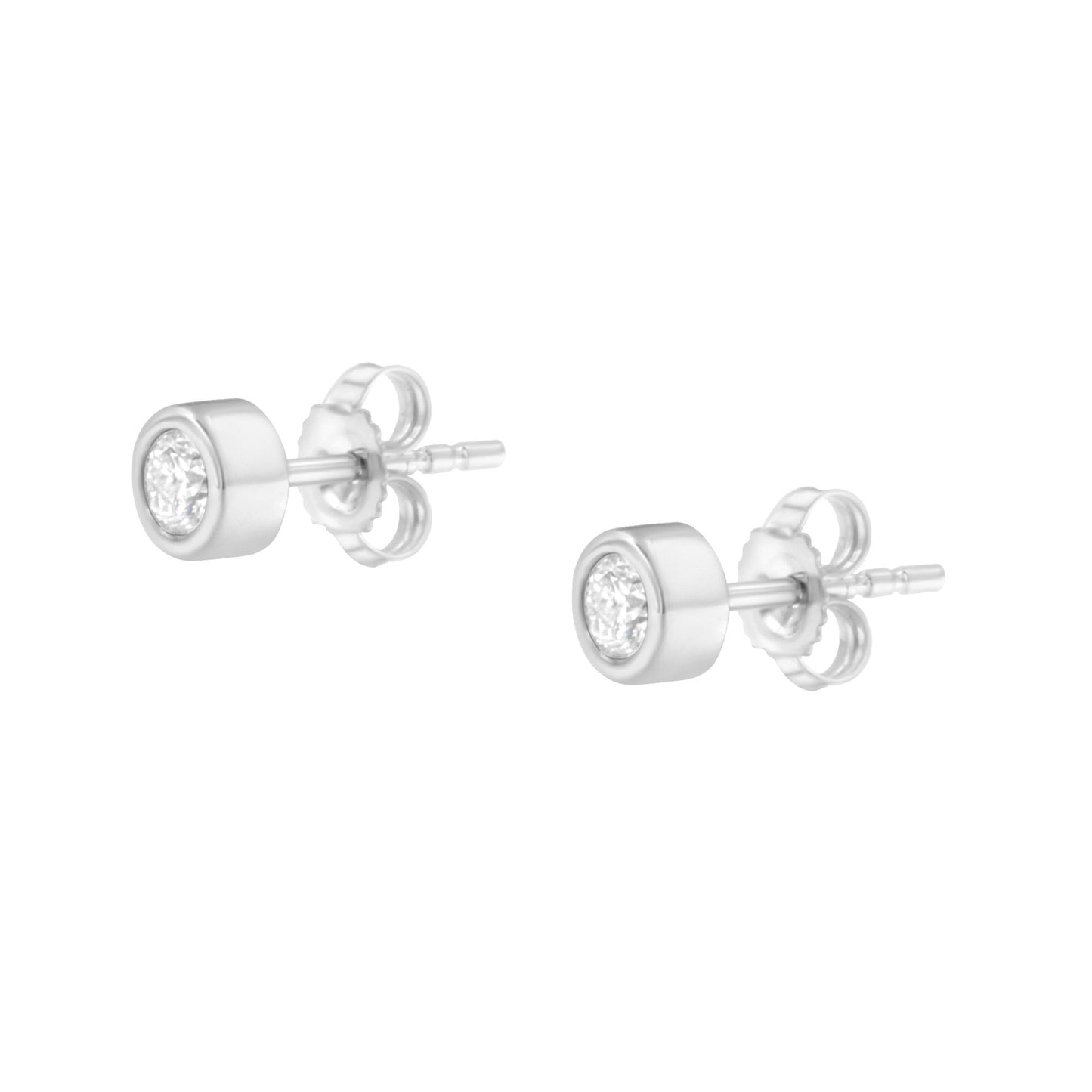 Pair of white metal stud earrings with round white gemstones in bezel settings, shown from a front angled view.