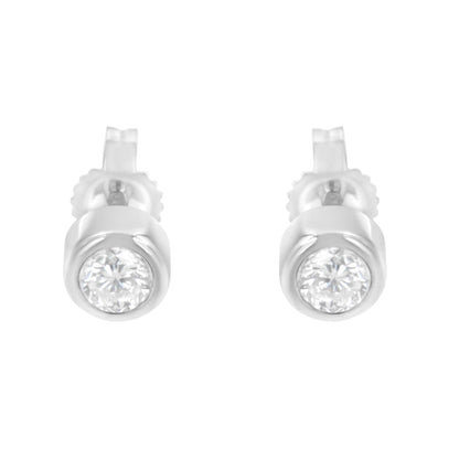 Front view of white metal stud earrings with round white gemstones in bezel settings.