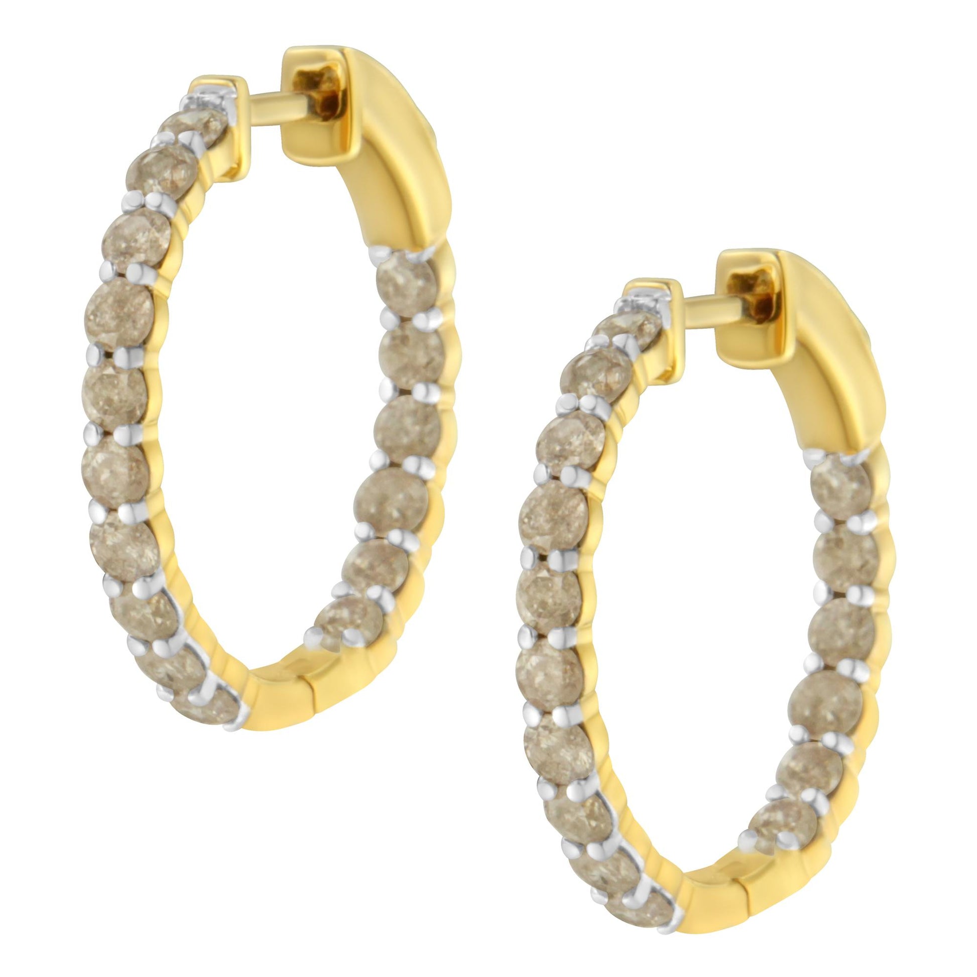 Pair of yellow metal hoop earrings with round brownish gemstones set in prong settings, shown at a slight angle.