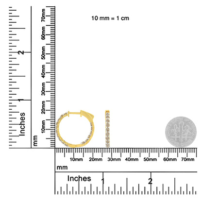 Front and side view of yellow metal hoop earrings with round brownish prong-set gemstones, shown on a ruler for size reference.