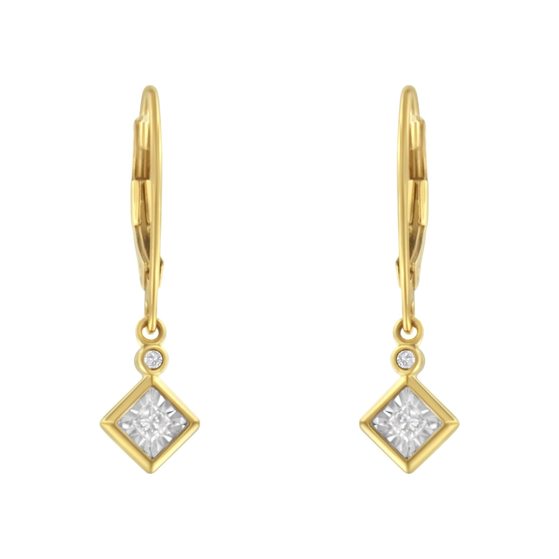 Front view of yellow and white metal drop earrings with a square white gemstone in a bezel setting and a smaller round white gemstone above it.