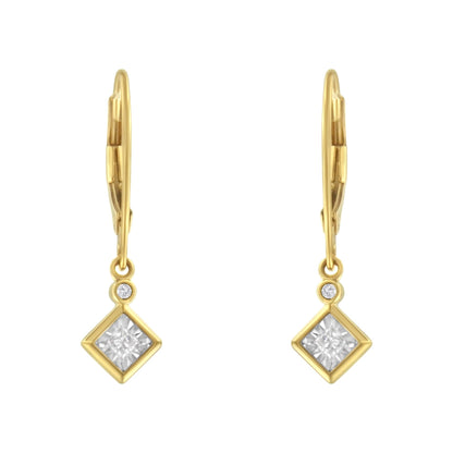 Front view of yellow and white metal drop earrings with a square white gemstone in a bezel setting and a smaller round white gemstone above it.