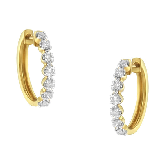 Pair of yellow metal hoop earrings with prong-set white round gemstones, shown from a front angle.