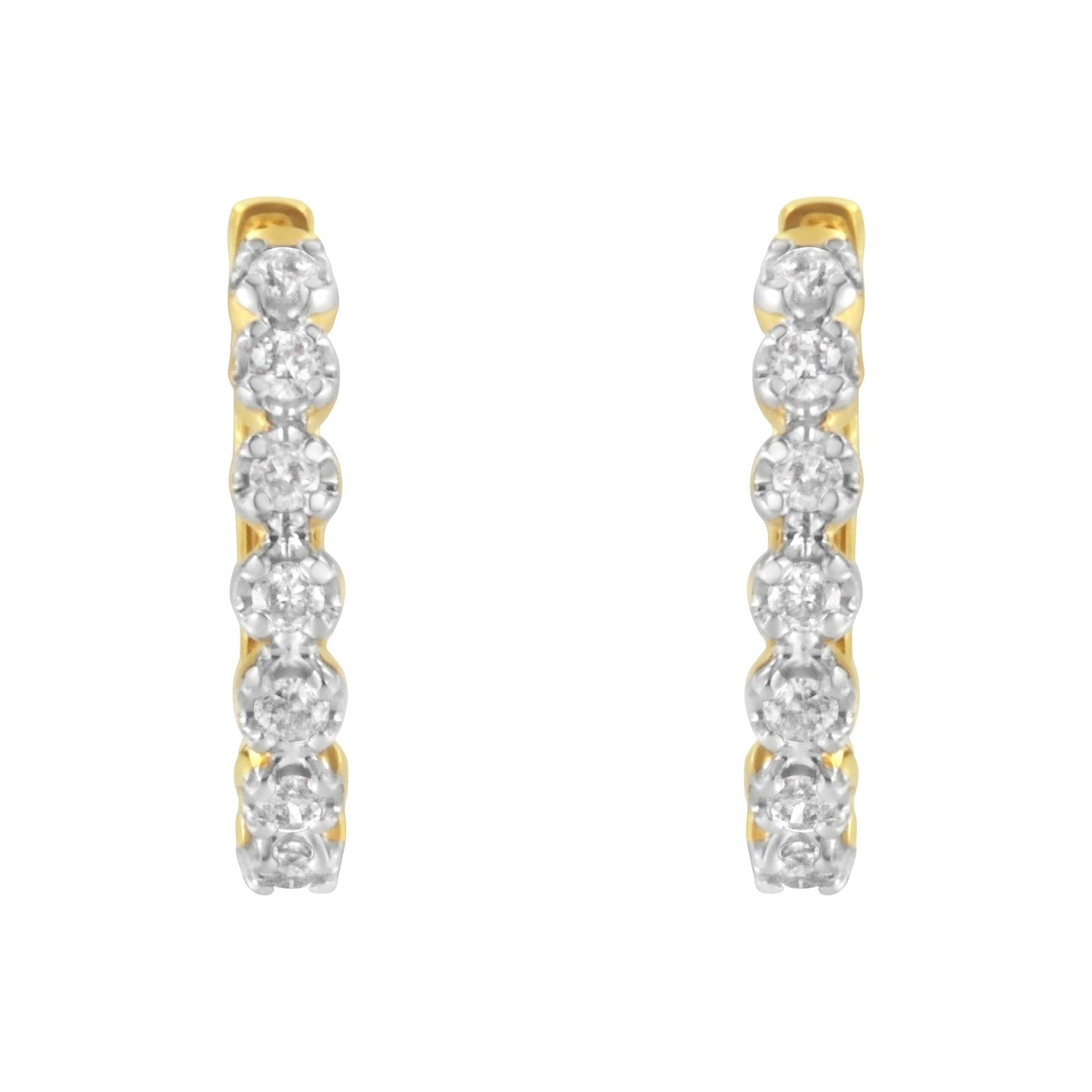 Front view of a pair of yellow metal hoop earrings with white round gemstones set in prong settings along the front.