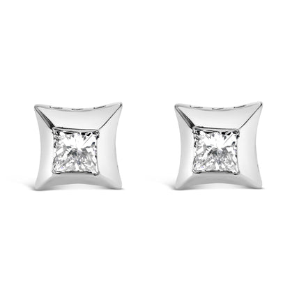 Front angle view of white metal square earrings with bezel-set white princess-shaped gemstones.