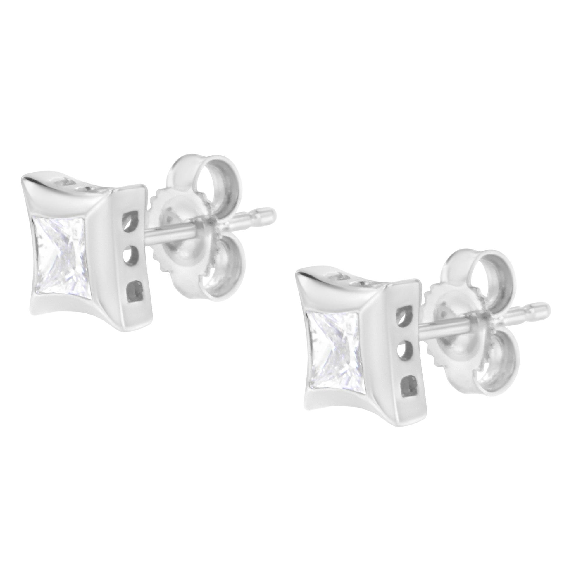Pair of white metal stud earrings with bezel-set white princess-shaped gemstones, shown in a front-angle view.