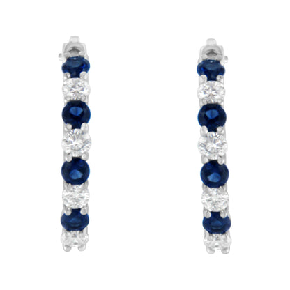 Front view of white metal hoop earrings with alternating round blue and white gemstones in prong settings.