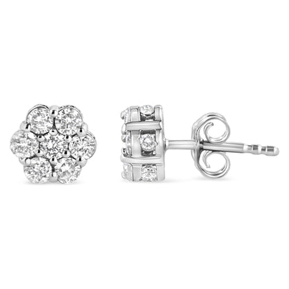 Front and side view of white metal stud earrings with round white gemstones in prong and channel settings.
