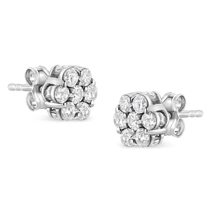 Pair of white metal stud earrings with round white gemstones in prong and channel settings, shown from a front angled view.