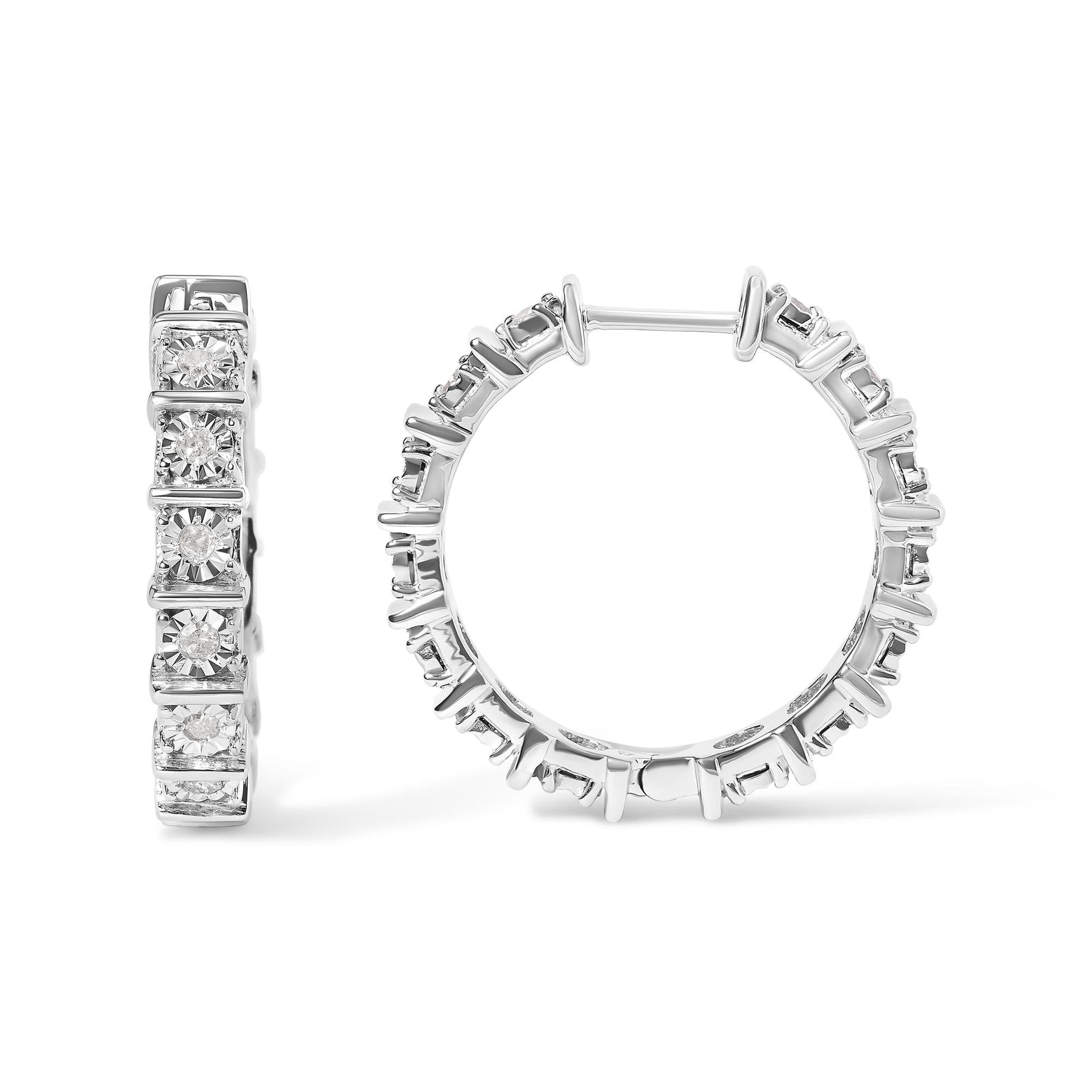 Front and side view of white metal hoop earrings with round white gemstones in miracle settings, shown on a white background.