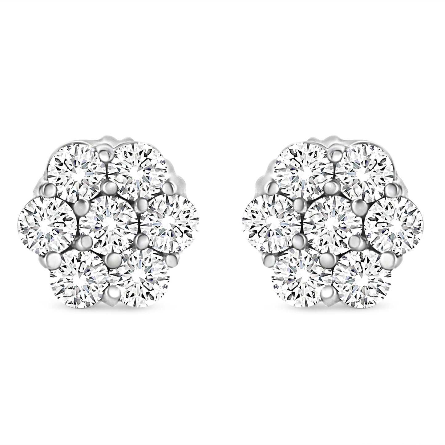 Front angle view of white metal cluster earrings with multiple round white gemstones in prong settings.