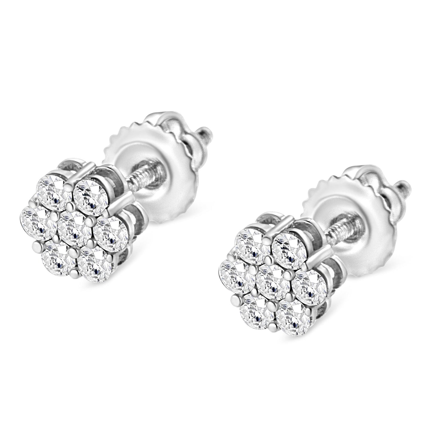 Close-up angle of a pair of white metal stud earrings with clusters of round white gemstones in a prong setting.