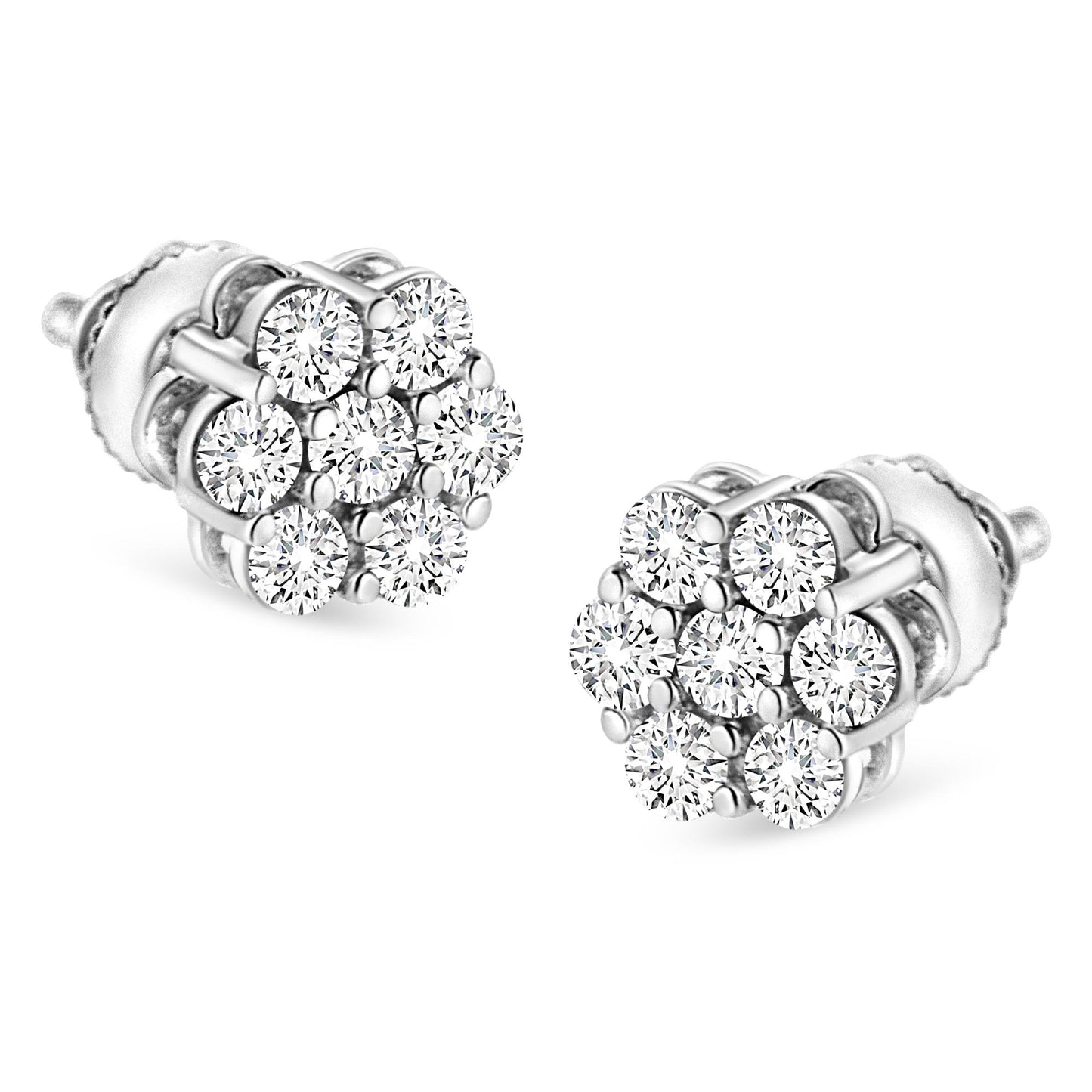 Pair of white metal stud earrings with clusters of round white gemstones in prong settings, shown at an angled close-up.