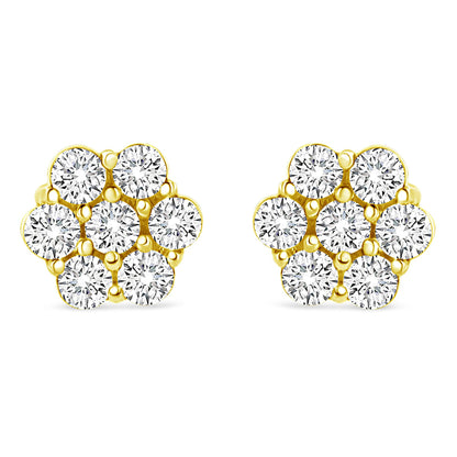 Front angle view of yellow metal cluster earrings with multiple round white gemstones in prong settings.