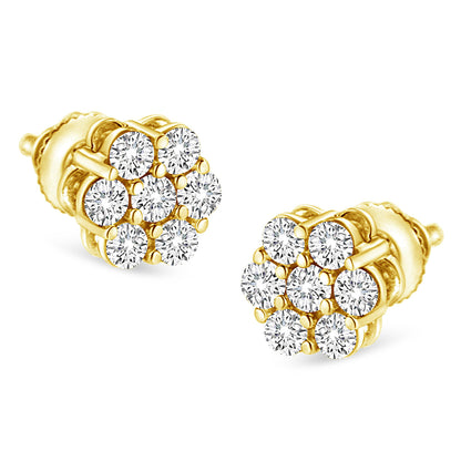 Close-up front angle of a pair of yellow metal stud earrings featuring clusters of round white gemstones in prong settings.