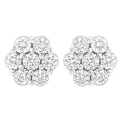 Front view of white metal cluster earrings with round white gemstones in prong settings.