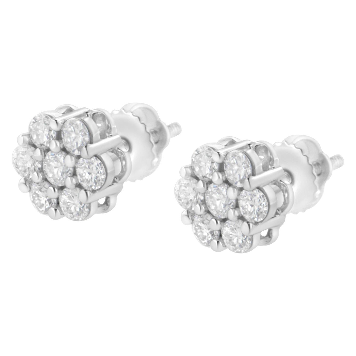 Pair of white metal stud earrings viewed from front angle, each featuring multiple round white gemstones in prong settings arranged in a cluster design.