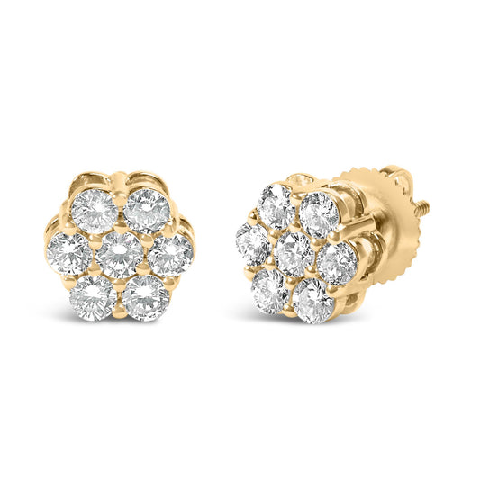 Pair of yellow metal stud earrings with round white gemstones in prong settings, shown from front and angled side views.