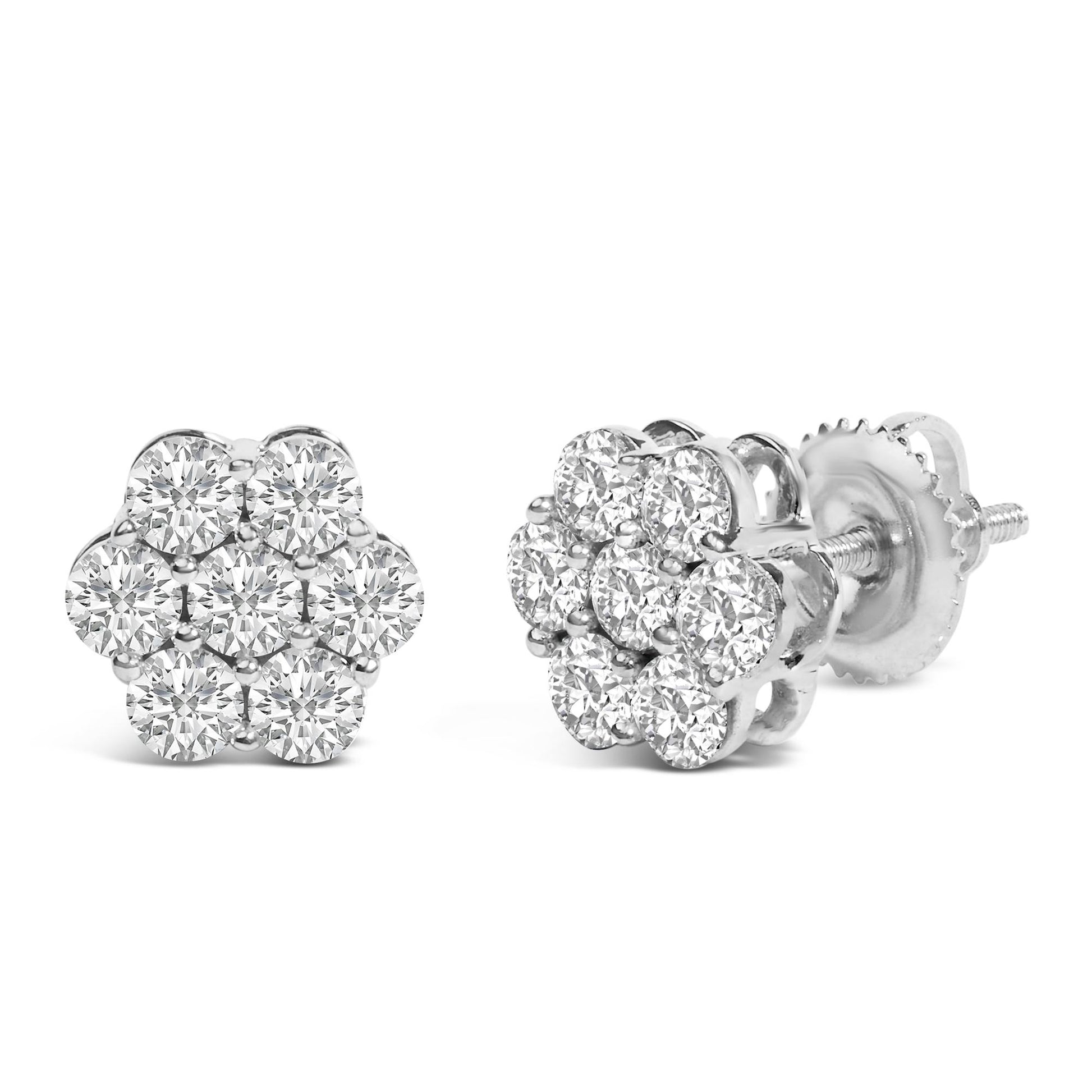 Close-up image of a pair of white metal stud earrings with round white gemstones in prong settings arranged in a floral cluster, shown from front and angled side view.