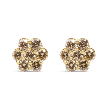 Front view of yellow metal flower-shaped earrings with multiple round white gemstones in prong settings.