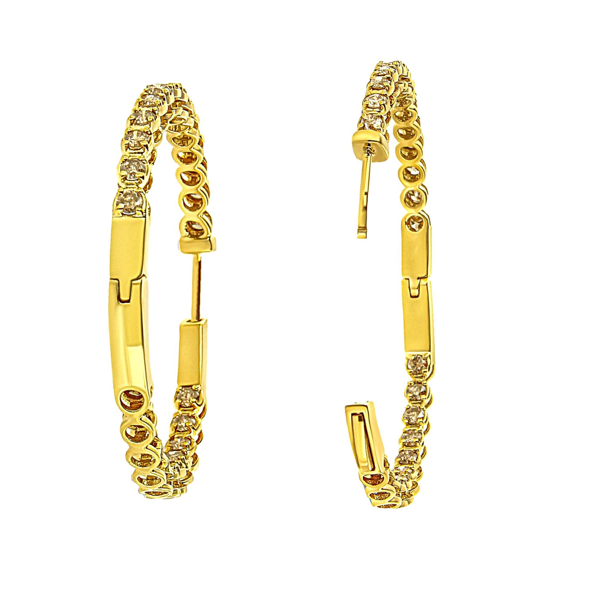 Pair of yellow metal hoop earrings with round champagne-colored gemstones in prong settings, shown from a side angle on a white background.