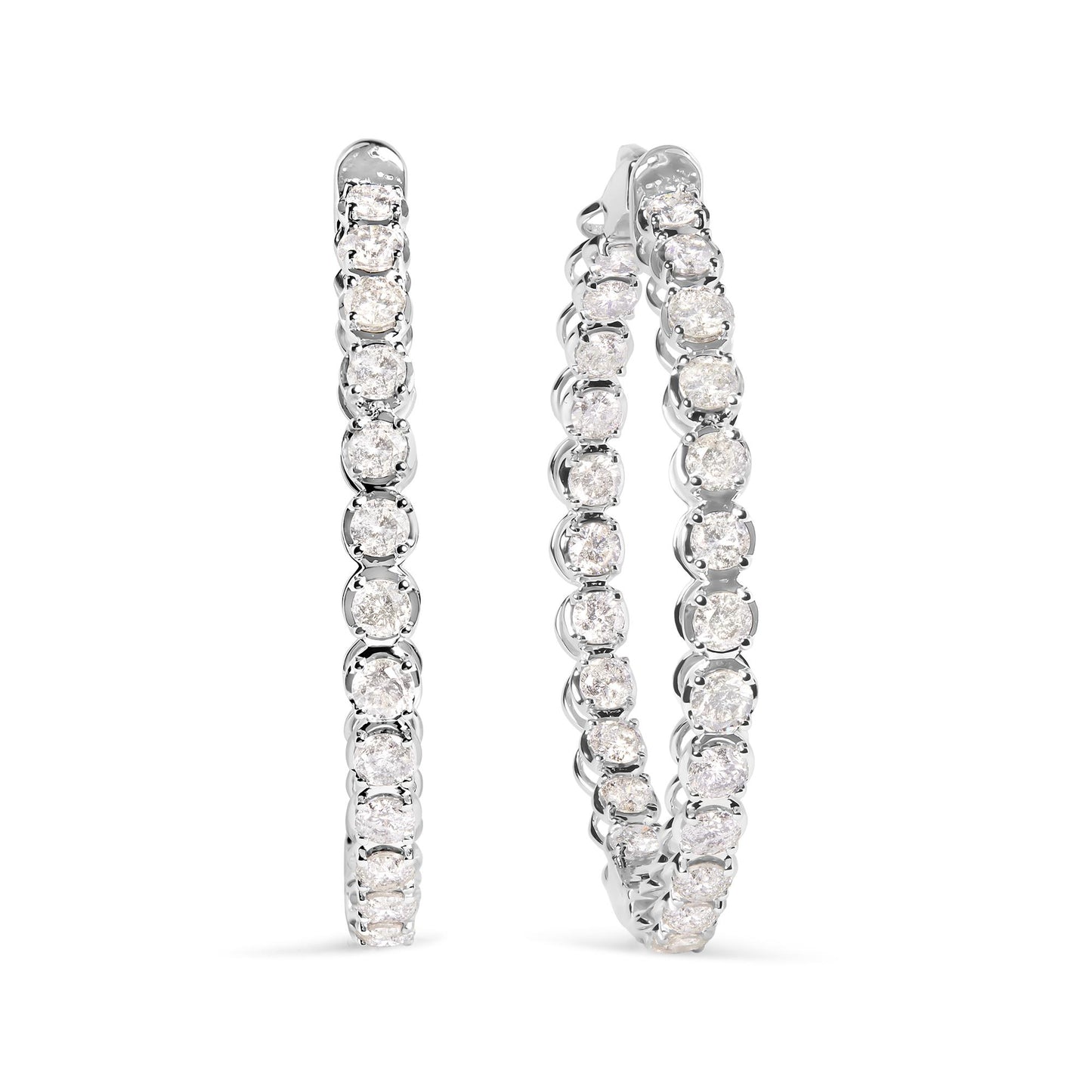 Pair of white metal hoop earrings set with round white gemstones in prong settings, shown from a front angle.