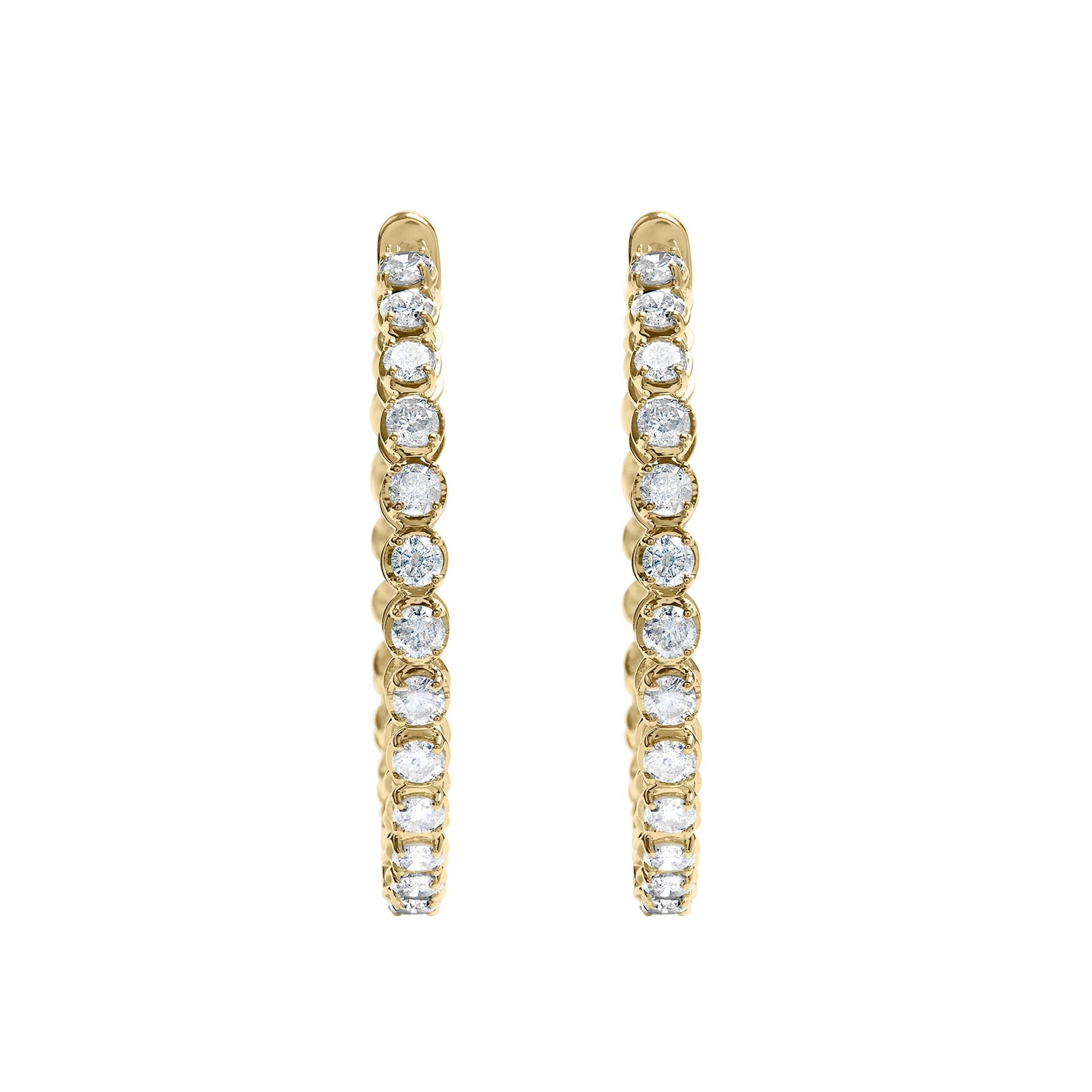 Pair of yellow metal hoop earrings with round white gemstones in prong settings, shown from the front angle on a white background.