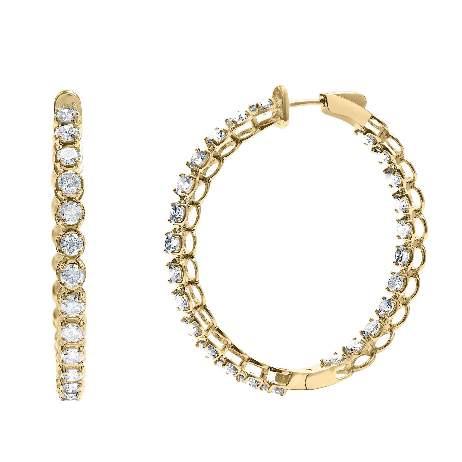 Close-up front and side views of a pair of yellow metal hoop earrings with round white gemstones in prong settings evenly spaced along the outer edge.