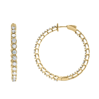 Close-up front and side view of yellow hoop earrings with round white gemstones in prong settings along the outer edges.