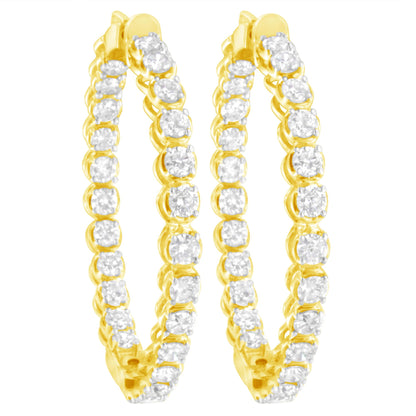 Front-facing pair of yellow metal hoop earrings set with round white gemstones in prong settings.
