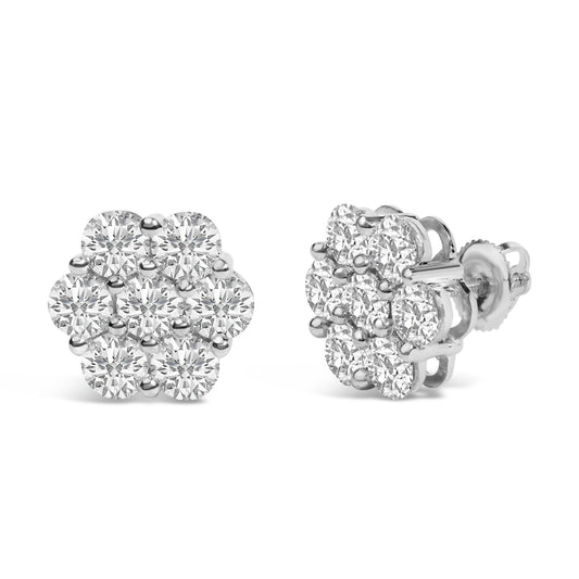 Close-up front and side view of white metal cluster earrings with round white gemstones in shared prong settings.