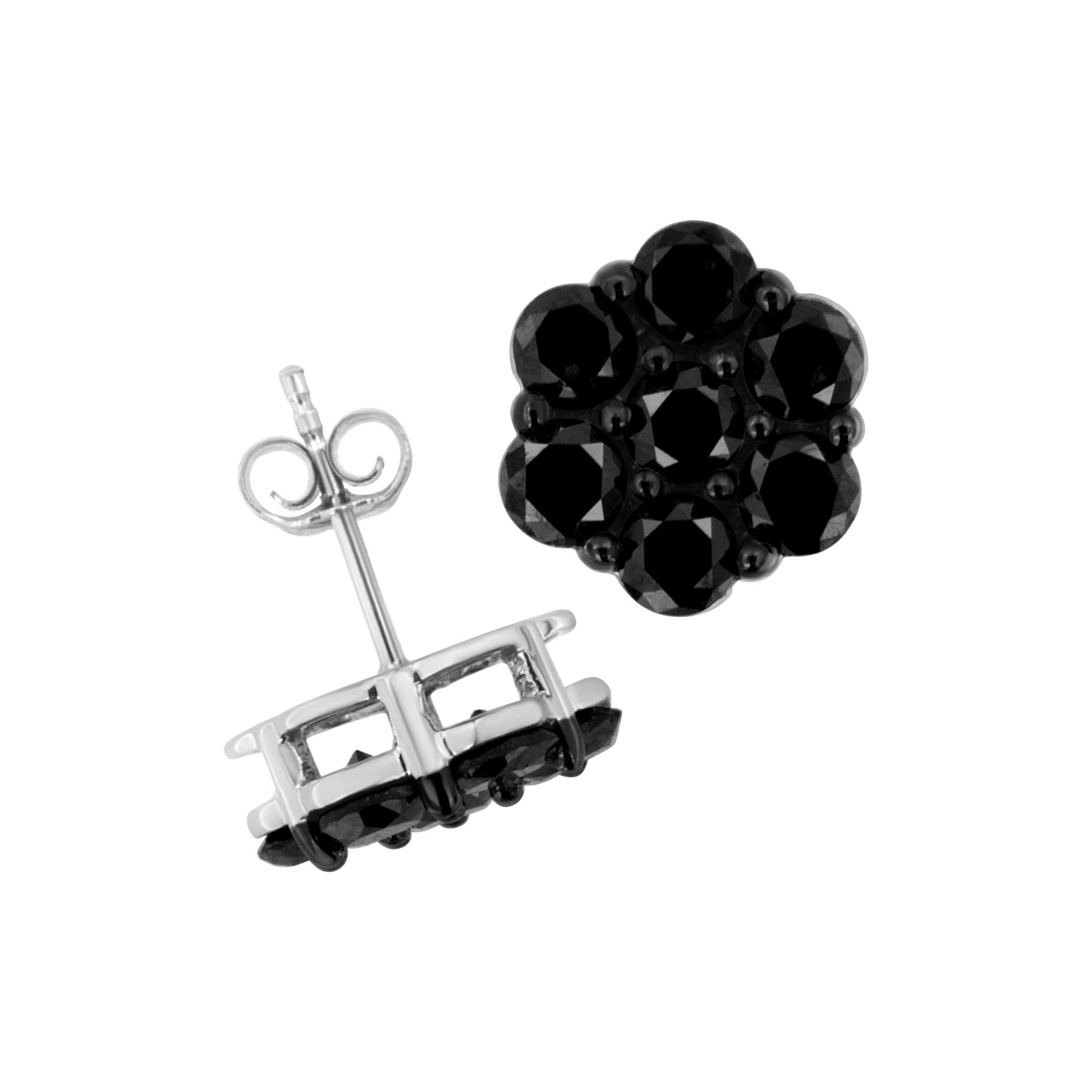 Close-up front and side views of a pair of white metal stud earrings featuring round black gemstones in a prong setting arranged in a cluster.