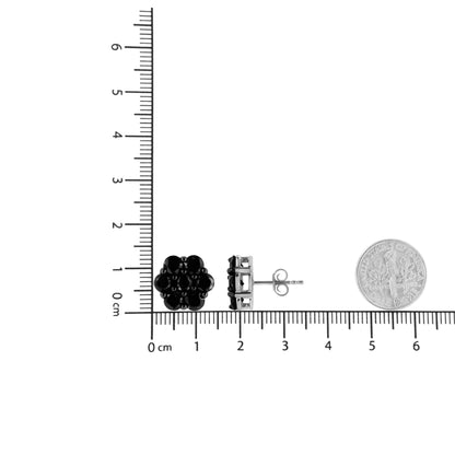 Pair of white metal stud earrings with clustered round black gemstones in prong settings, shown from front and side angles on a ruler for size reference.