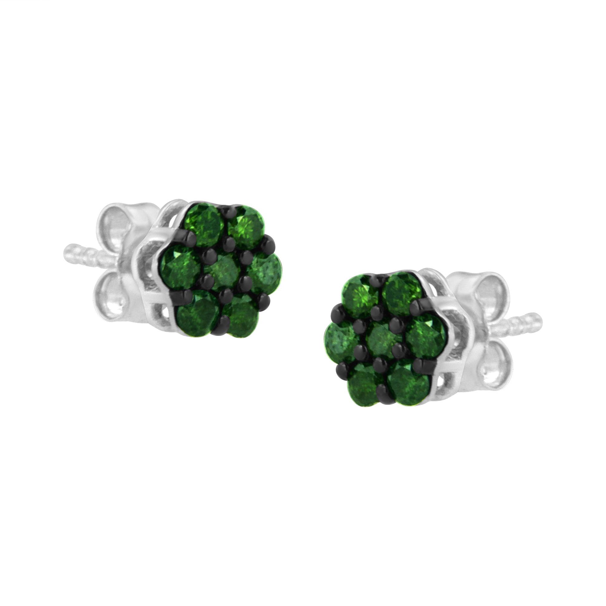 Pair of white metal stud earrings with clusters of round green gemstones in prong settings, shown from a front angled view.
