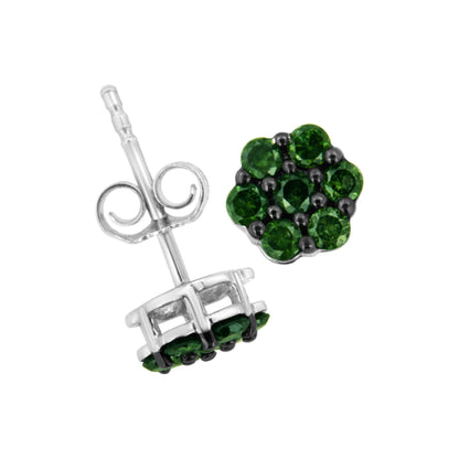 Close-up front and side angle of white metal stud earrings featuring a cluster of round green gemstones in prong settings.