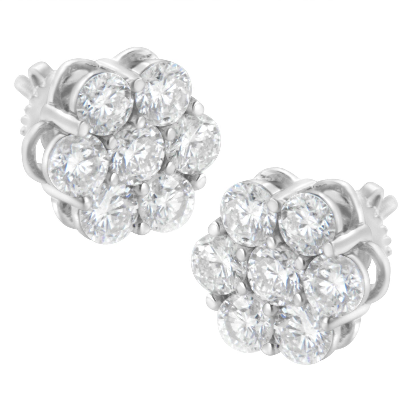Pair of white metal stud earrings with round white gemstones in prong settings arranged in a cluster, shown from a front angle.