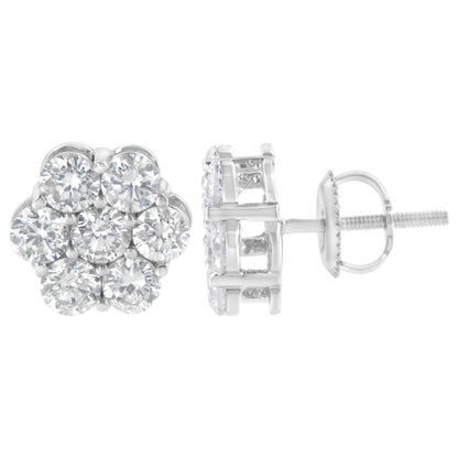 Pair of white metal stud earrings with round white gemstones set in a cluster, shown from front and side angles.