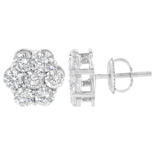 Pair of white metal stud earrings with round white gemstones set in a cluster, shown from front and side angles.