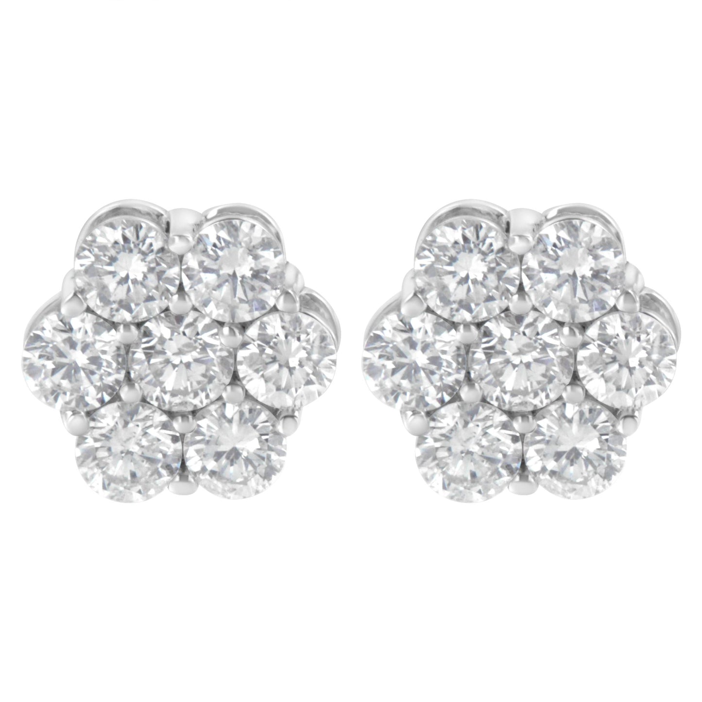Pair of white metal cluster earrings with multiple round white gemstones in prong settings, front view.
